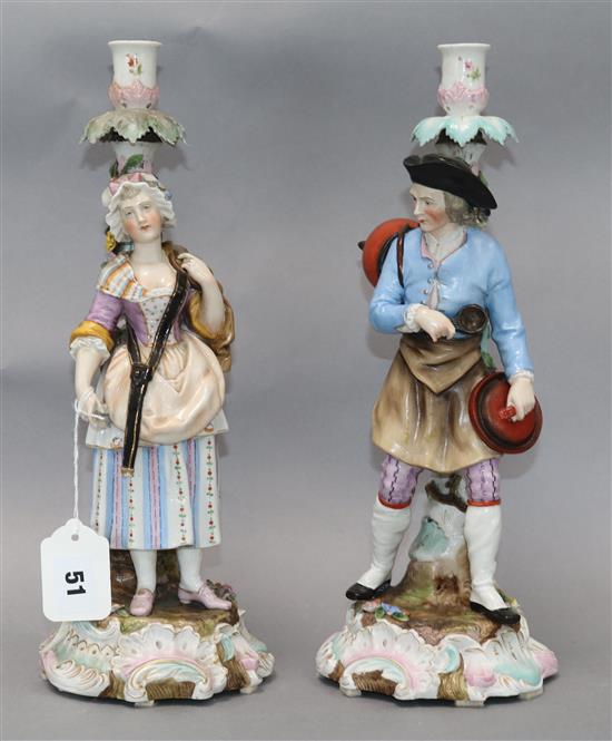 A pair of German porcelain figural candlesticks 36cm